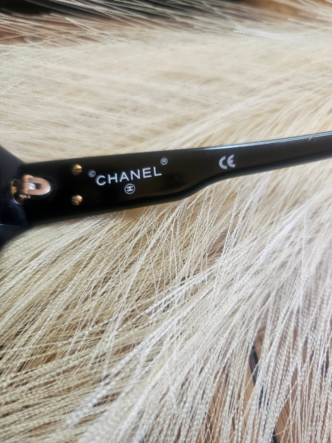 Chanel branding on inner arm