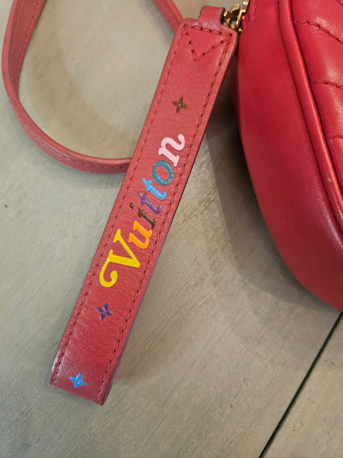 Vuitton leather tag front detail
