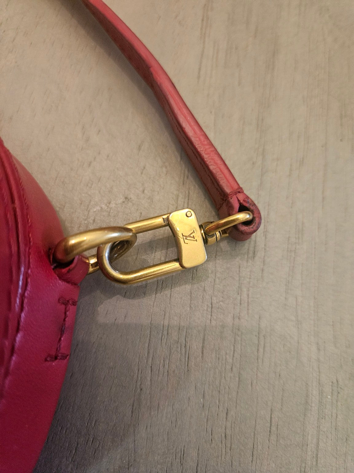 Gold-tone strap clasp close-up