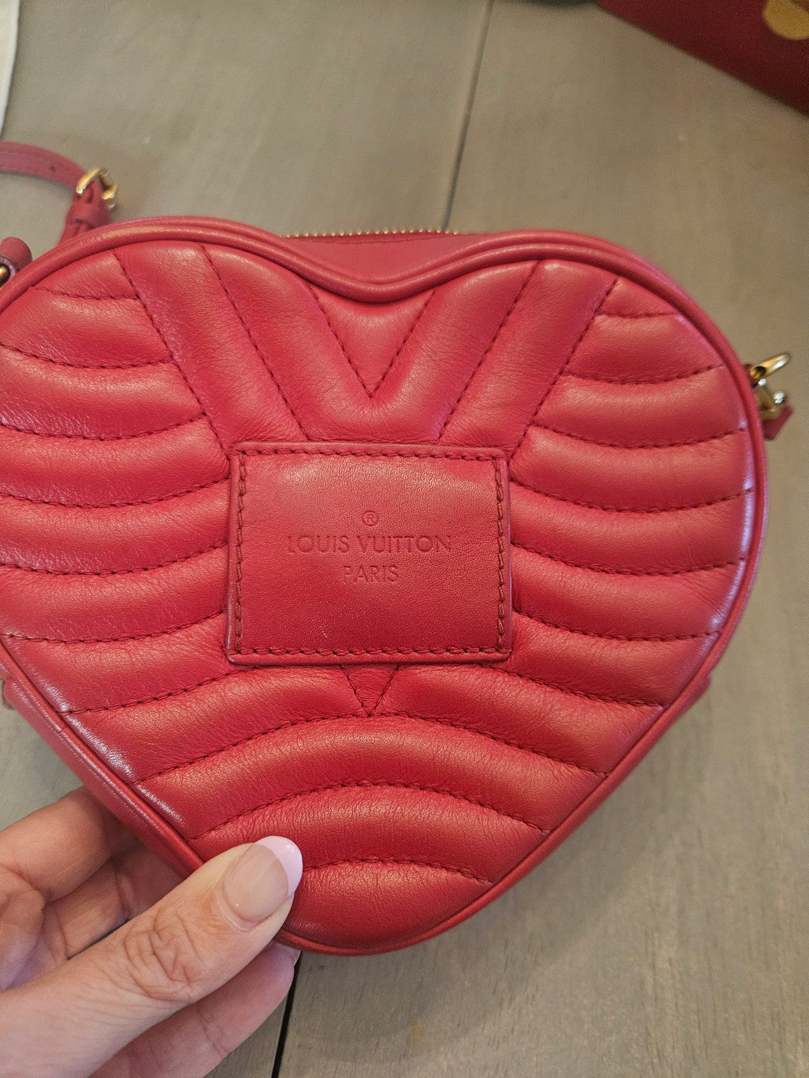 Back quilted leather and embossed Louis Vuitton patch