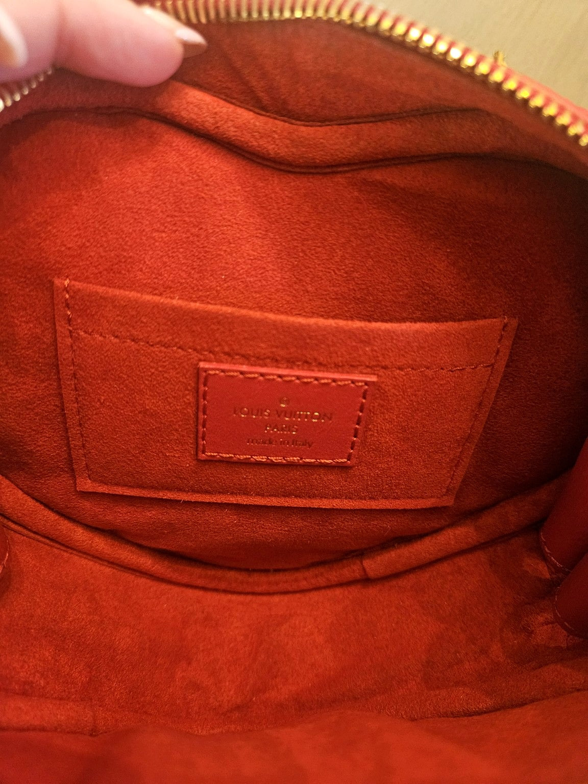 Enhanced photograph of red Louis Vuitton heart crossbody bag, detail 6