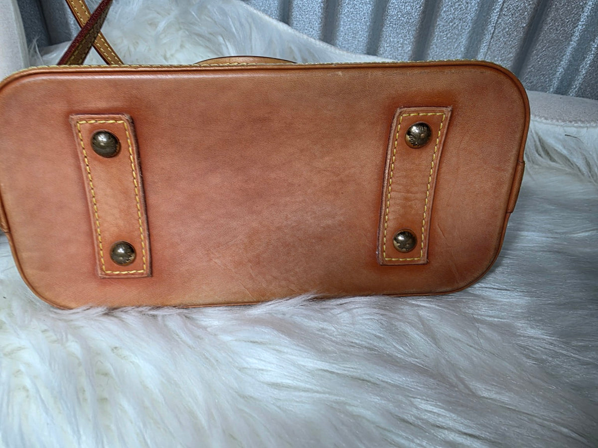Bottom leather panel showing patina and feet