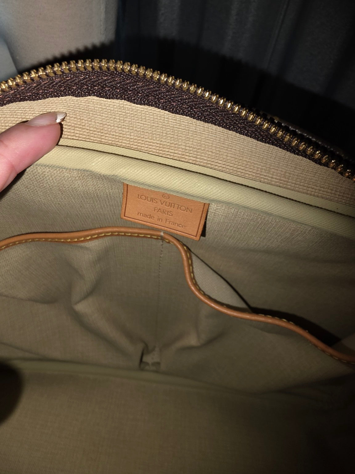 Interior brand stamp and beige fabric lining